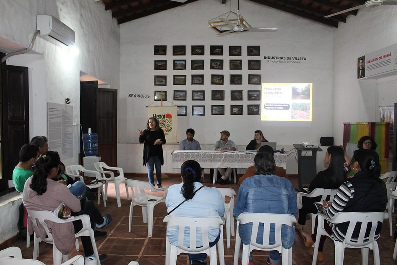 2022-04-22-presentation-omega-case-study-villeta- Picture of participant in Degrowth Conference 2019 studying the programme