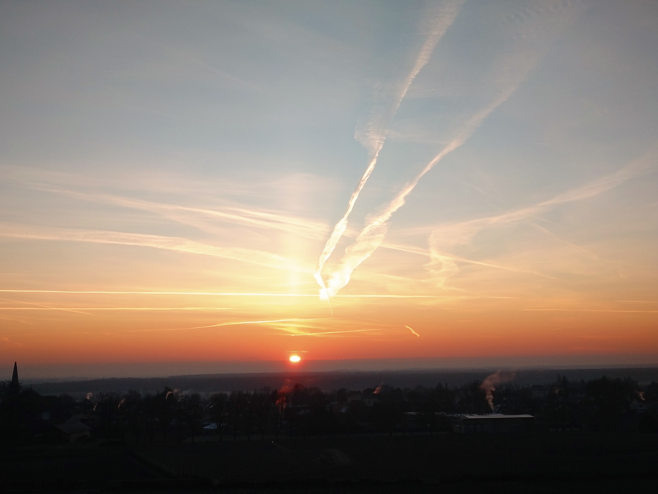 Contrails at sunrise