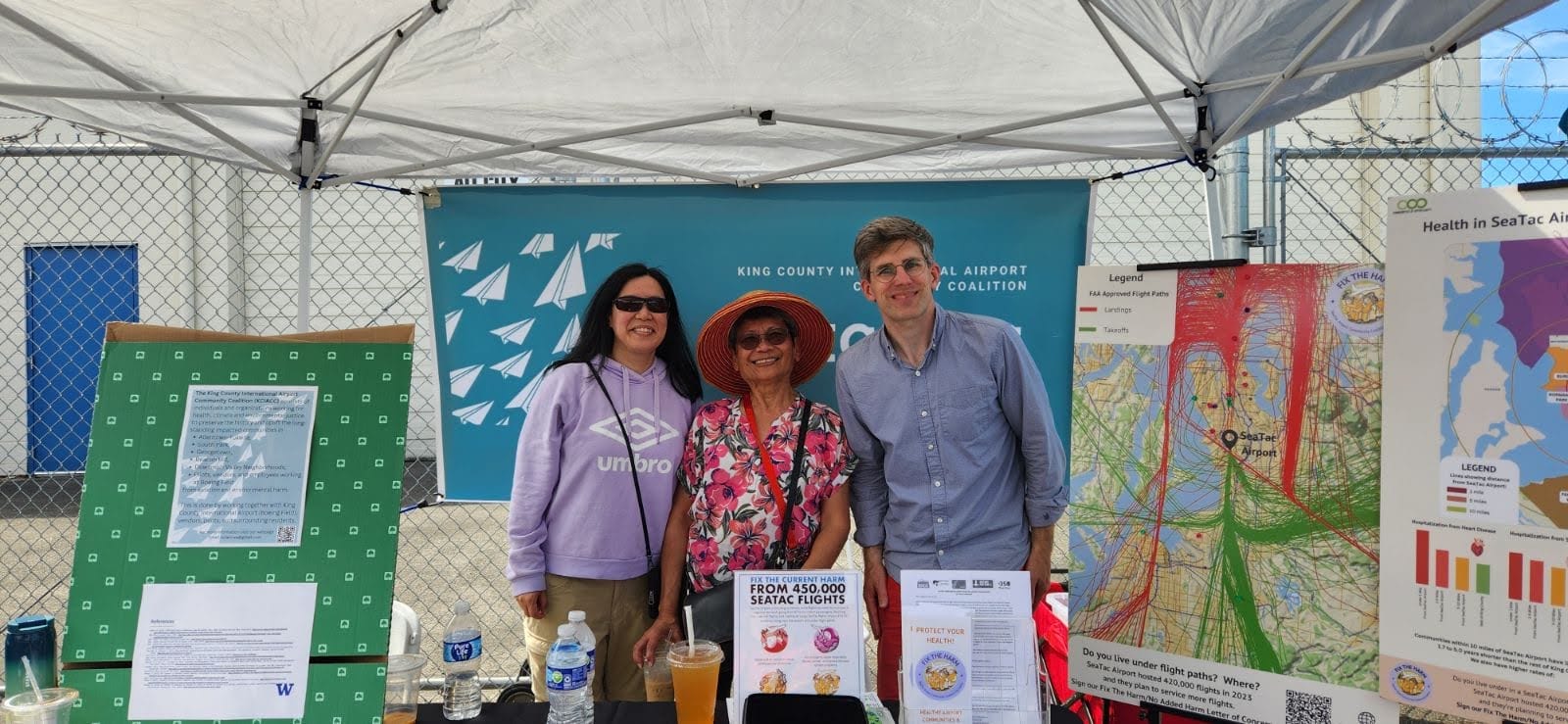 King County International Airport Struggle Three campaigners from the struggle against King County International Airport tabling at a local community resource fair